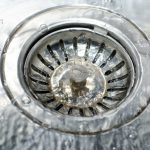 high-angle-closeup-shot-water-pouring-water-drain